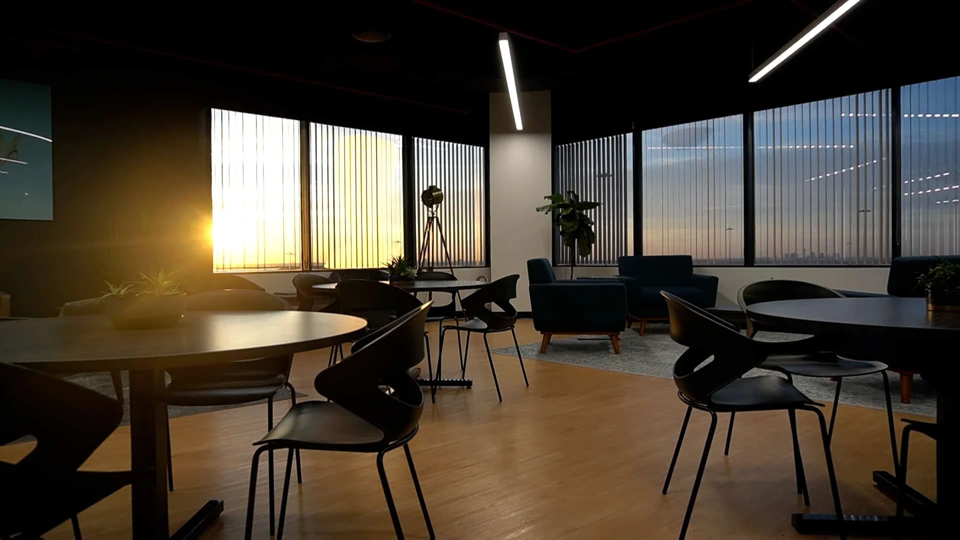 The SA Cowork member lounge at sunset, with skyline views over Northwest San Antonio